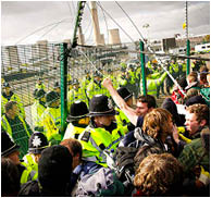 (photoshoot 1009-049) Police grapple with protestors attempting to gain access to Ratcliffe-on-Soar power station during a Camp for Climate Action rally today.  E.ON